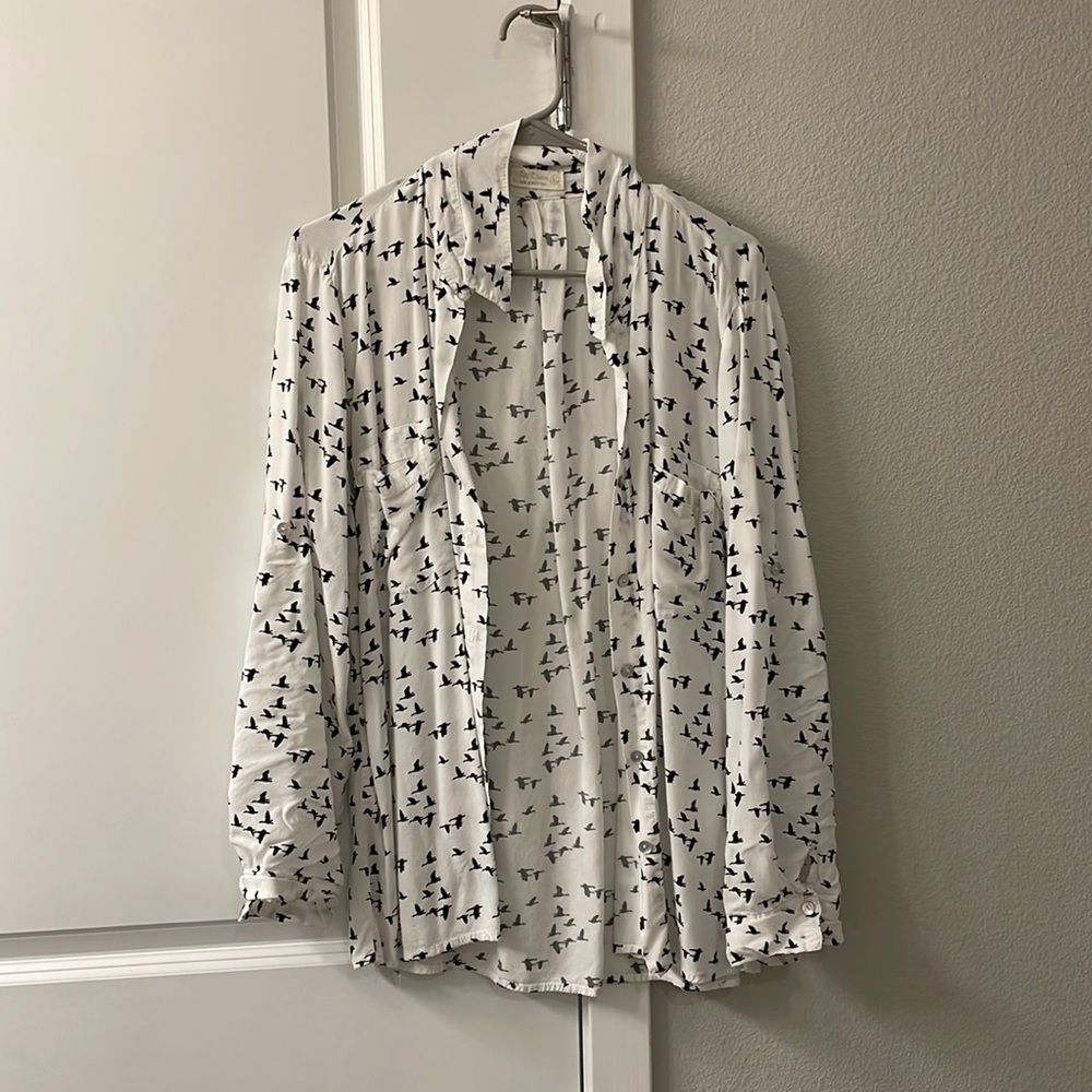 White and black button down blouse.